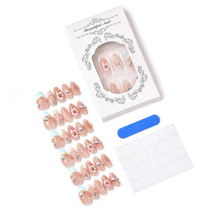 Acrylic nail set with filigree shell and flower decorations Acalora