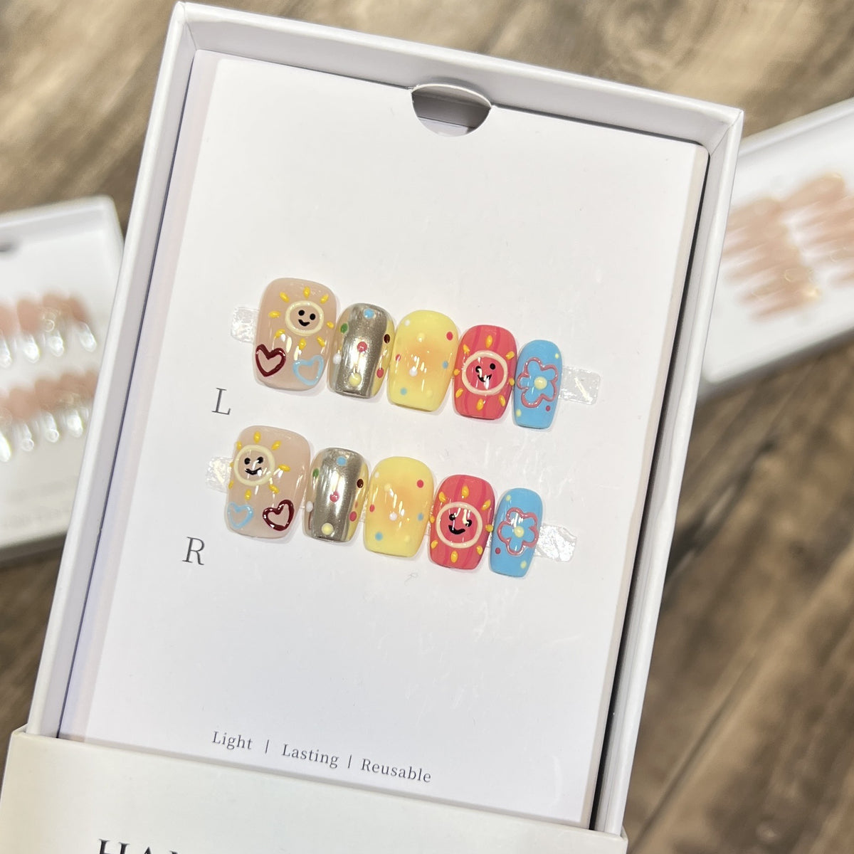 Whimsical Press-On Nail Art Set with Smiley Faces and Floral Designs Acalora