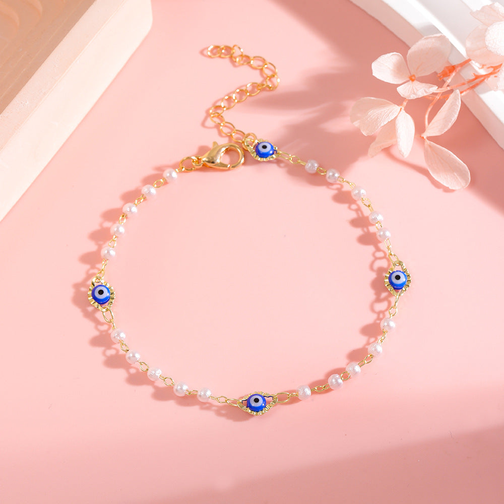 Elegant Pearl and Eye Charm Necklace Acalora
