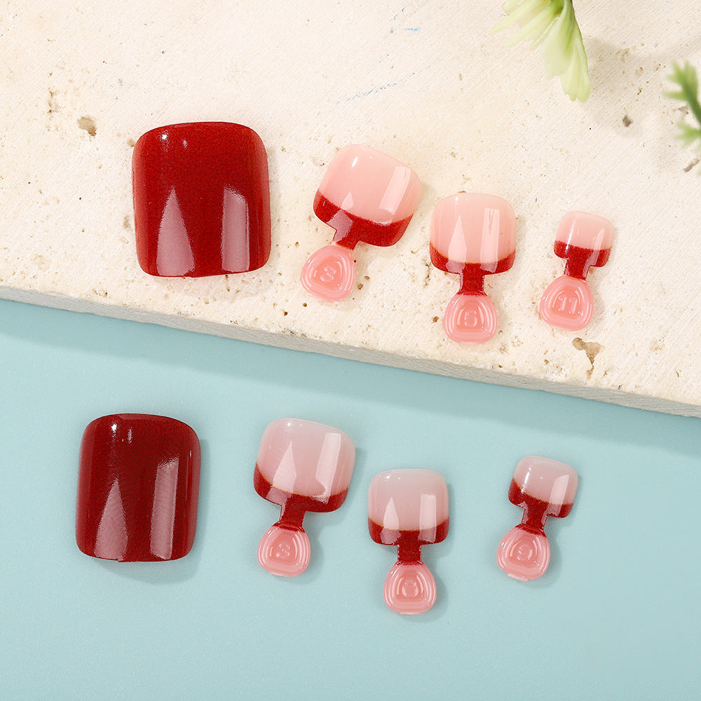 Acrylic nail set in elegant red and nude design Acalora