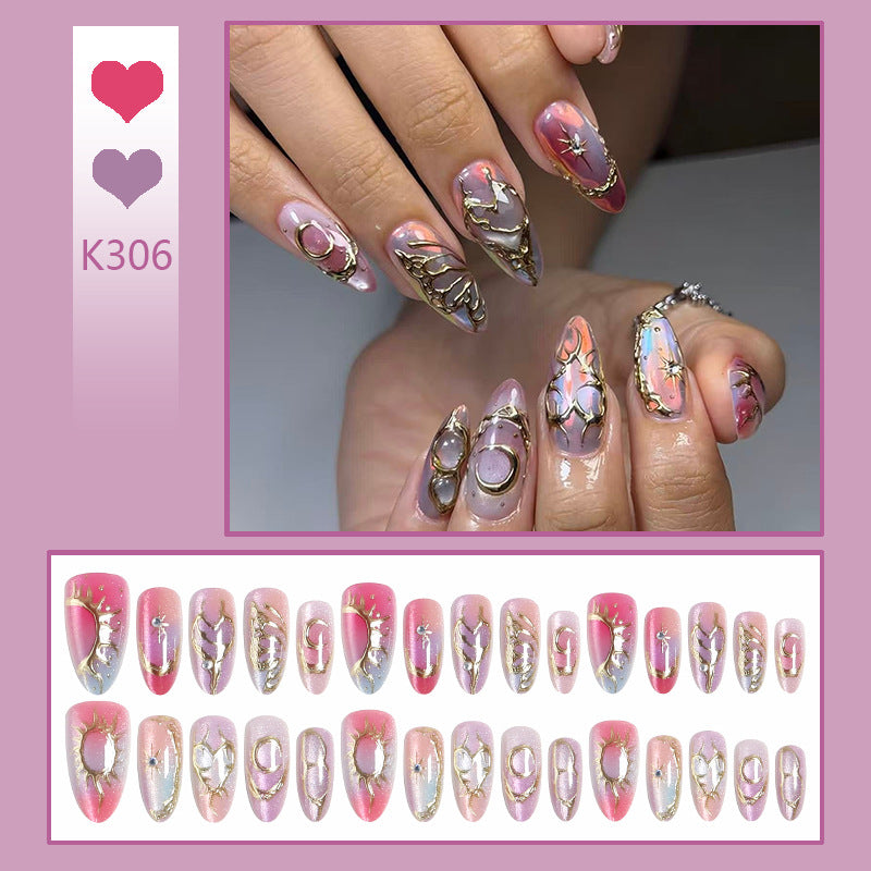 Acrylic nail set with glamorous 3D designs and elegant gold accents Acalora