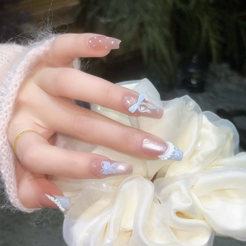 Art nail set with filigree bows and glitter accents Acalora