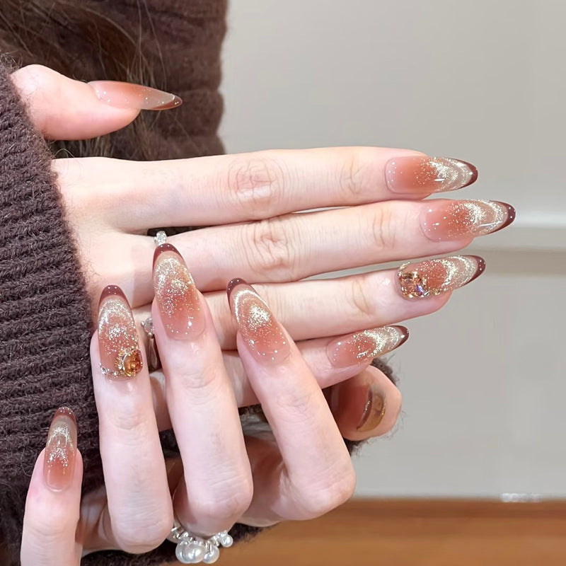 Glamorous art nails with glitter and stone accents Acalora