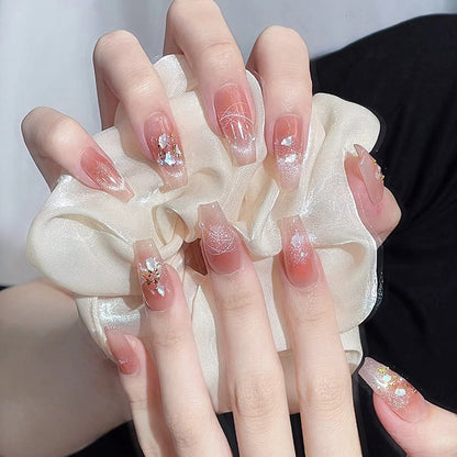 Artificial nail set with elegant glitter and flower decorations Acalora