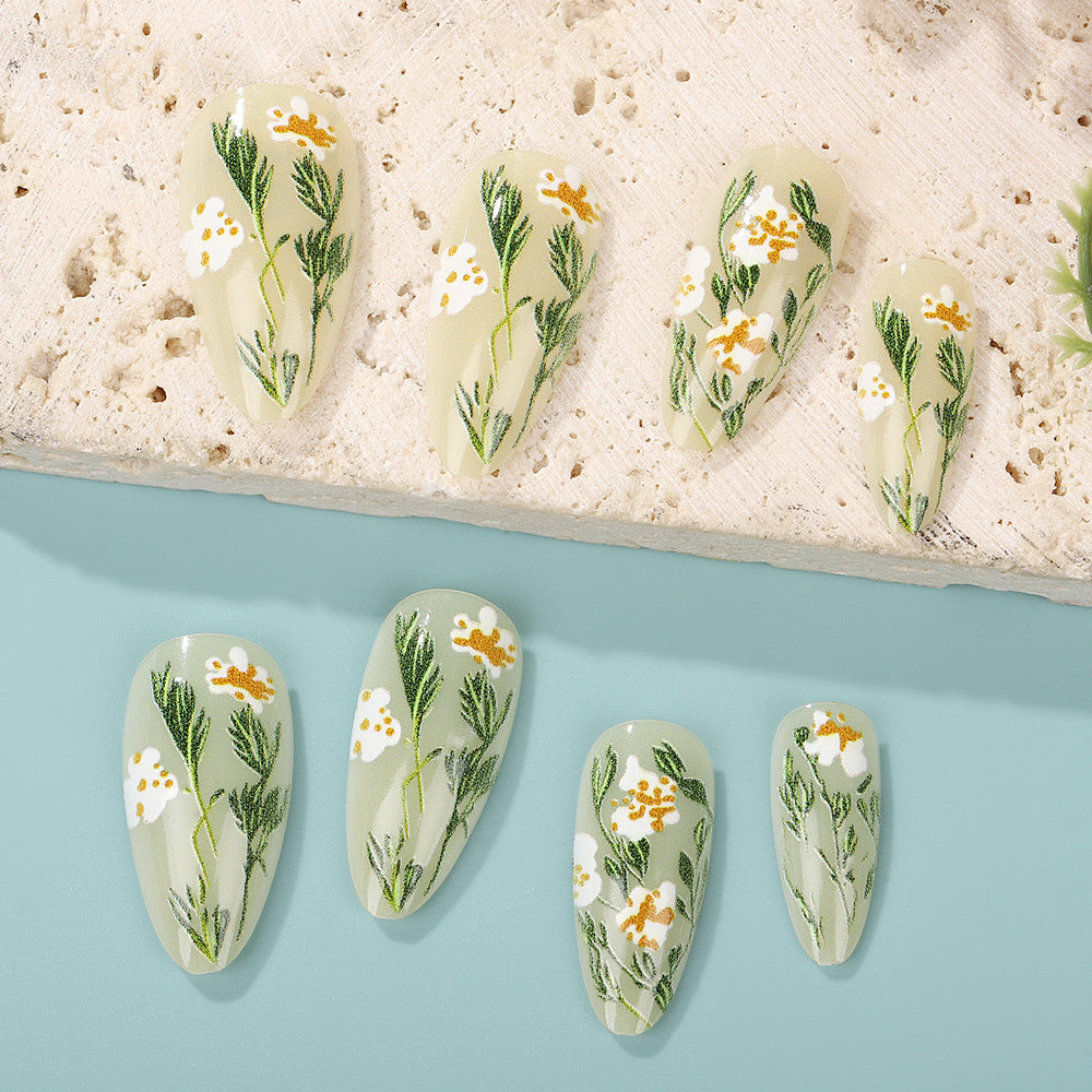 Handmade art nails with floral accents Acalora