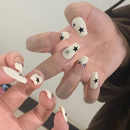 Artificial nail set with glamorous star design and sparkling accents Acalora