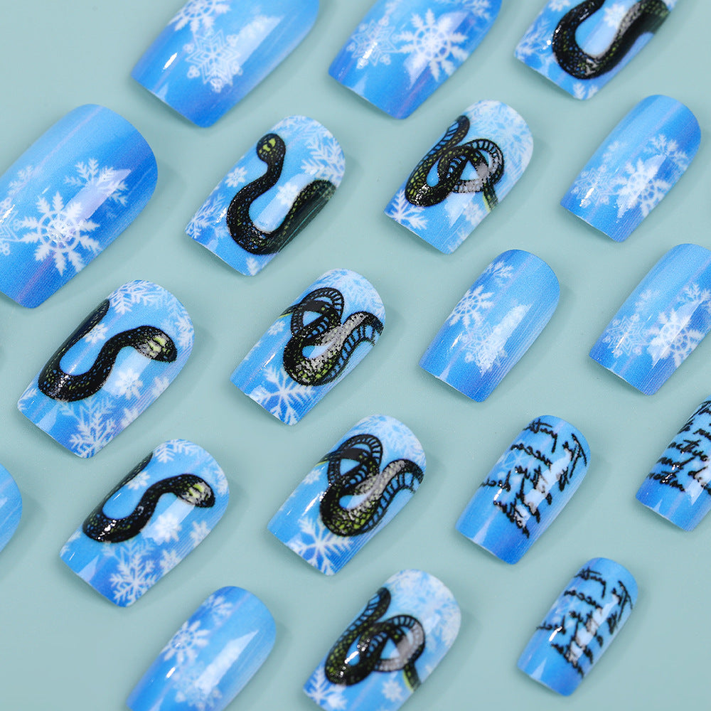 Creative art nails with snowflake and snake motif Acalora