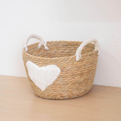 Handwoven storage basket with heart design Acalora