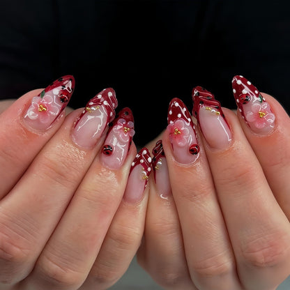 Creative tip design artificial nails with floral accents Acalora
