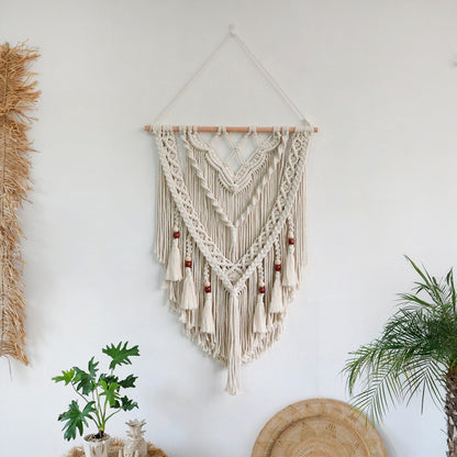 Hand-woven macrame wall hanging with decorative tassels