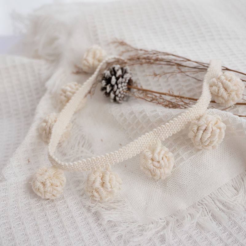 Decorative border with pompons Acalora