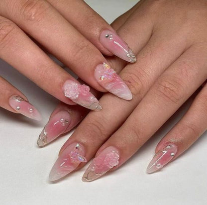 Artificial nail creation with floral 3D details and glitter accents Acalora