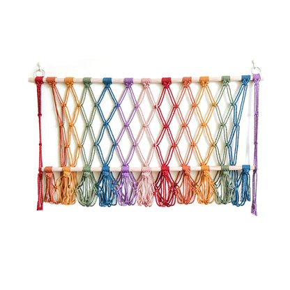 Elegant macramé wall hanging with decorative tassels and wooden frame