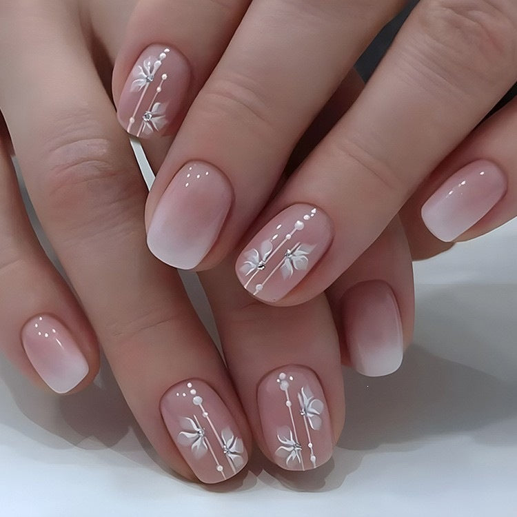 Artificial nails in elegant French tip design Acalora