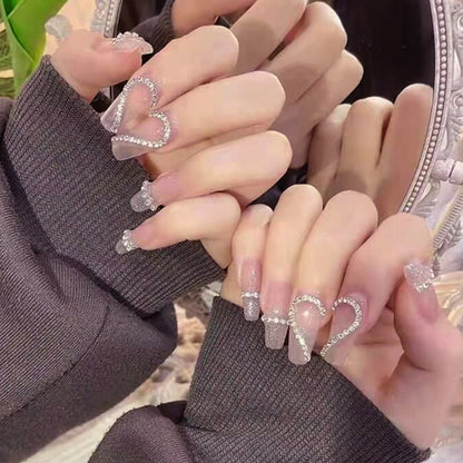 Glamorous artificial nails with heart and glitter design Acalora