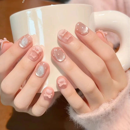 Artificial nails with delicate bow and glitter motifs Acalora
