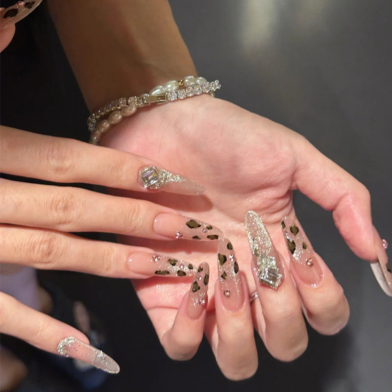 Glamorous artificial nail set with fun leopard pattern and glittering accents Acalora