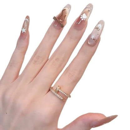 Glamorous artificial nails with creative embellishments Acalora