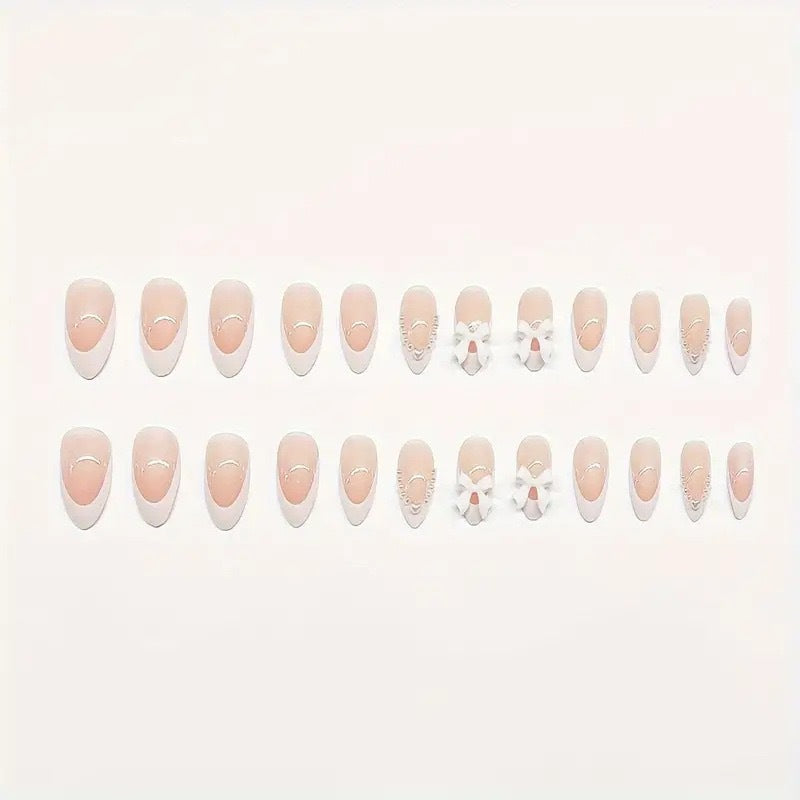 Artistic Press-On Nail Design with Bow Accents Acalora