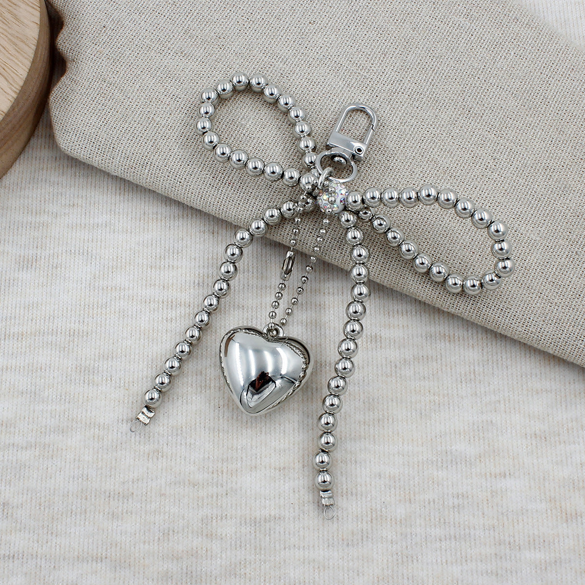 Elegant Beaded Bow Brooch Acalora