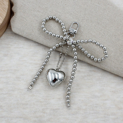 Elegant Beaded Bow Brooch Acalora