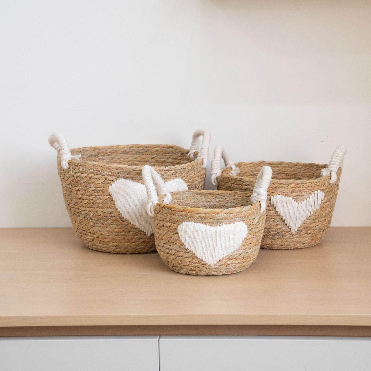 Handwoven storage basket with heart design Acalora