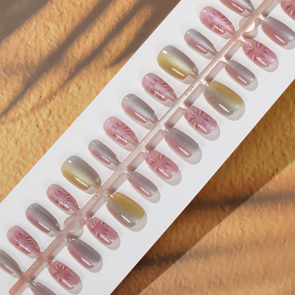 Artificial nails in modern ombre design with floral accents Acalora