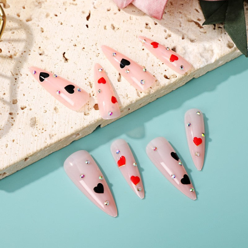 Glamorous artificial nails with heart accents Acalora