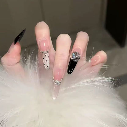 Acrylic nail set with elegant tips and glamorous rhinestone accents Acalora