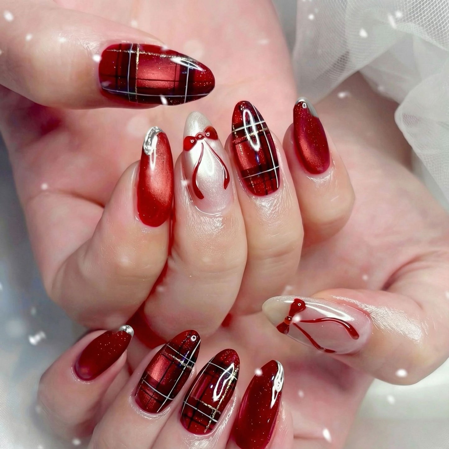 Art nail set with festive design and bow accents Acalora