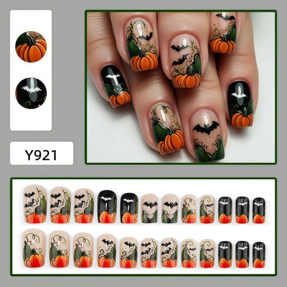 Artificial nails in Halloween design with pumpkins and ghosts Acalora