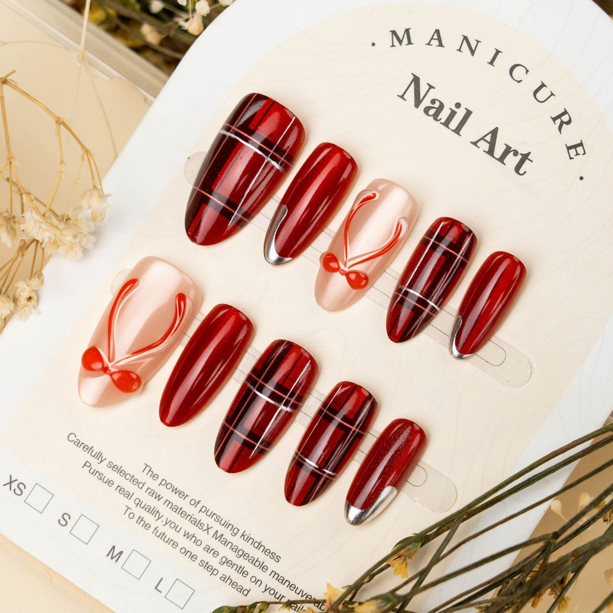 Art nail set with festive design and bow accents Acalora