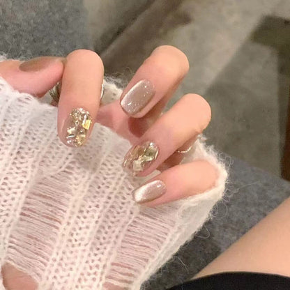 Artificial nail set with elegant glitter pattern and golden accents Acalora