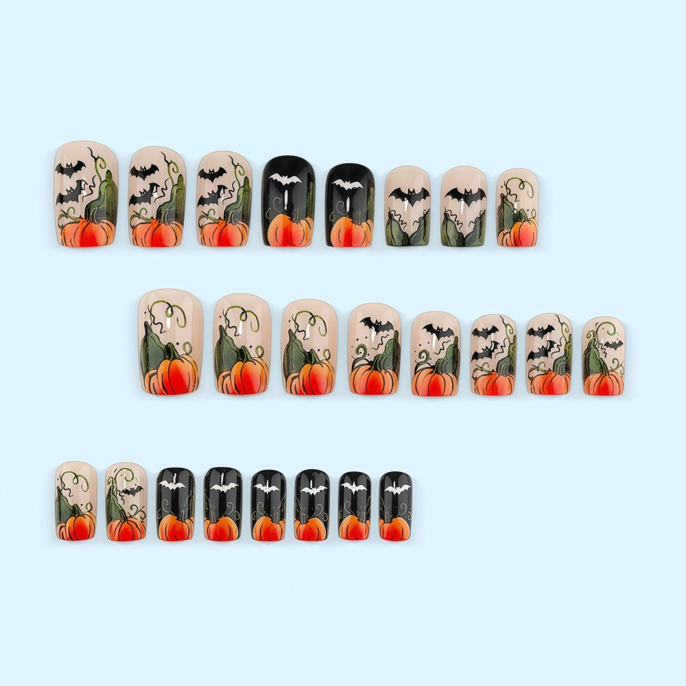 Artificial nails in Halloween design with pumpkins and ghosts Acalora