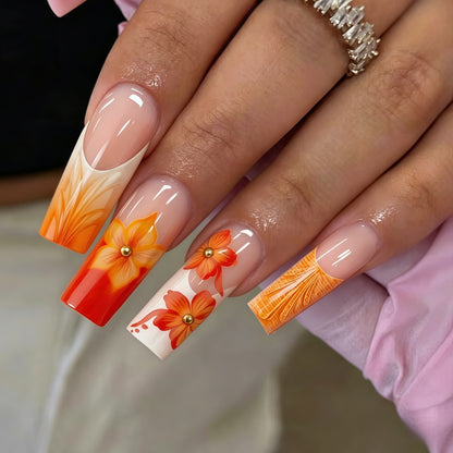 Nail art with floral accents and glitter Acalora