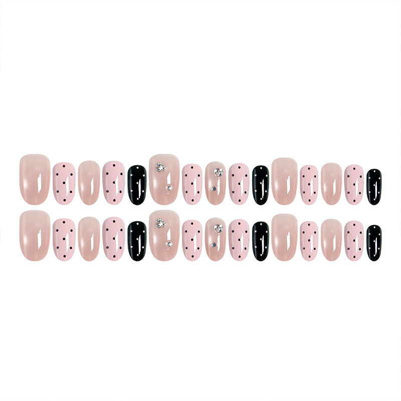 Acrylic nail set with glamorous rhinestone accents and modern dots Acalora