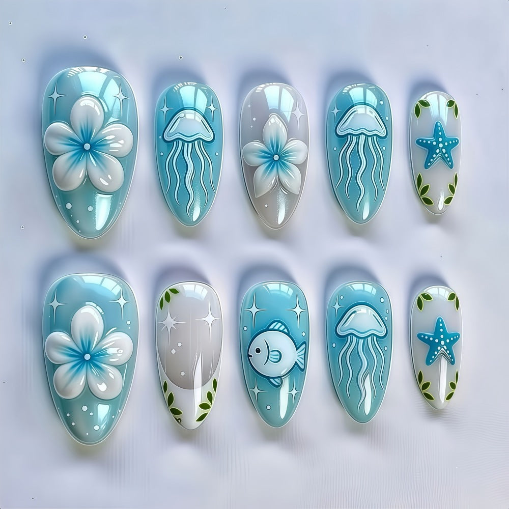 Artificial nails in a maritime design with colorful shell and water motifs Acalora