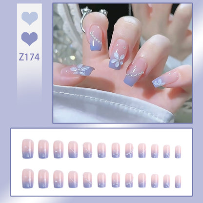 Nail set with elegant floral accents and glitter embellishments Acalora