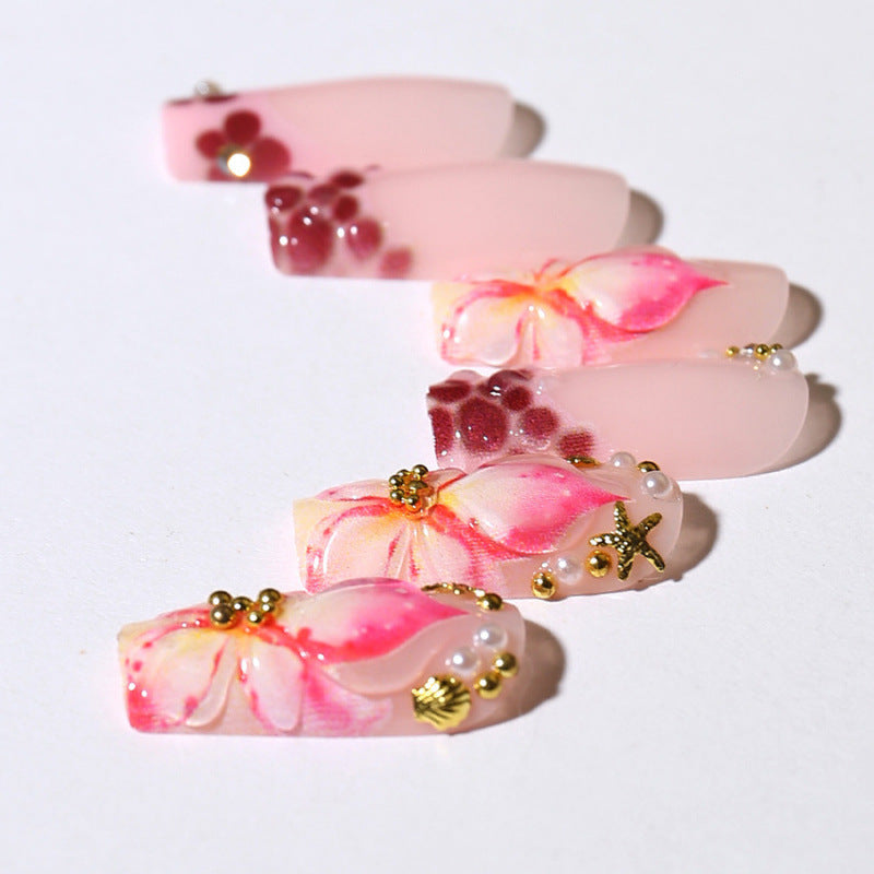 Acrylic nail set with exclusive flower design and sparkling accents Acalora