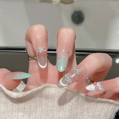 Artificial nail set with elegant bow and cherry designs Acalora