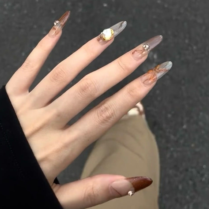 Glamorous artificial nails with creative embellishments Acalora