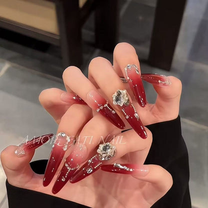 Acrylic nail set with elegant tips and glamorous rhinestone accents Acalora