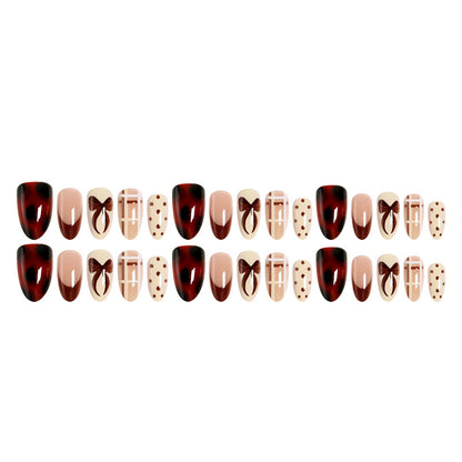 Artificial nail set with elegant bow and caramel designs Acalora