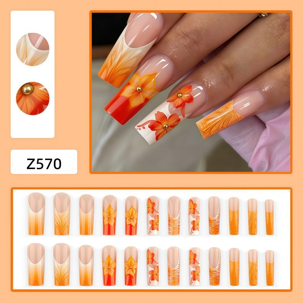 Nail art with floral accents and glitter Acalora