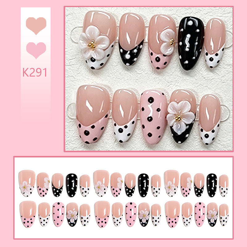 Nail art set with floral accents and elegant dots Acalora