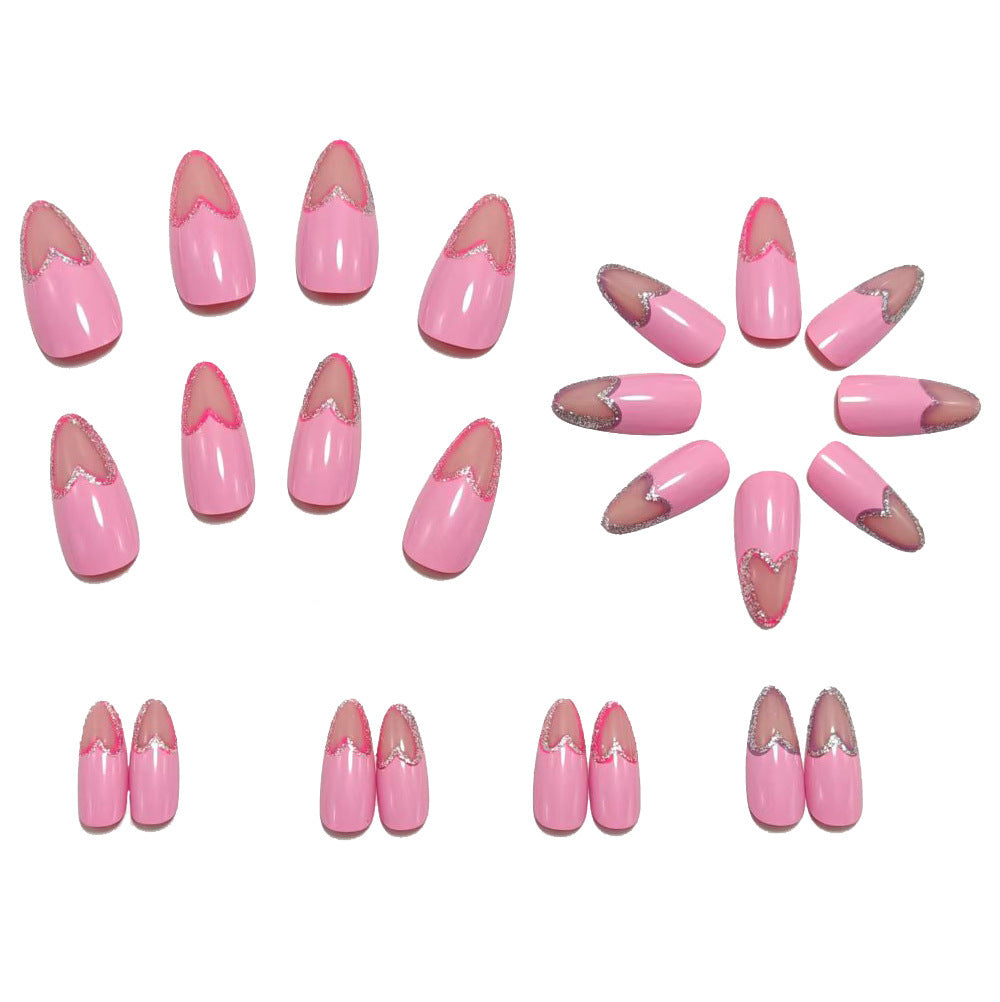 Art nails with heart design and glitter accents Acalora