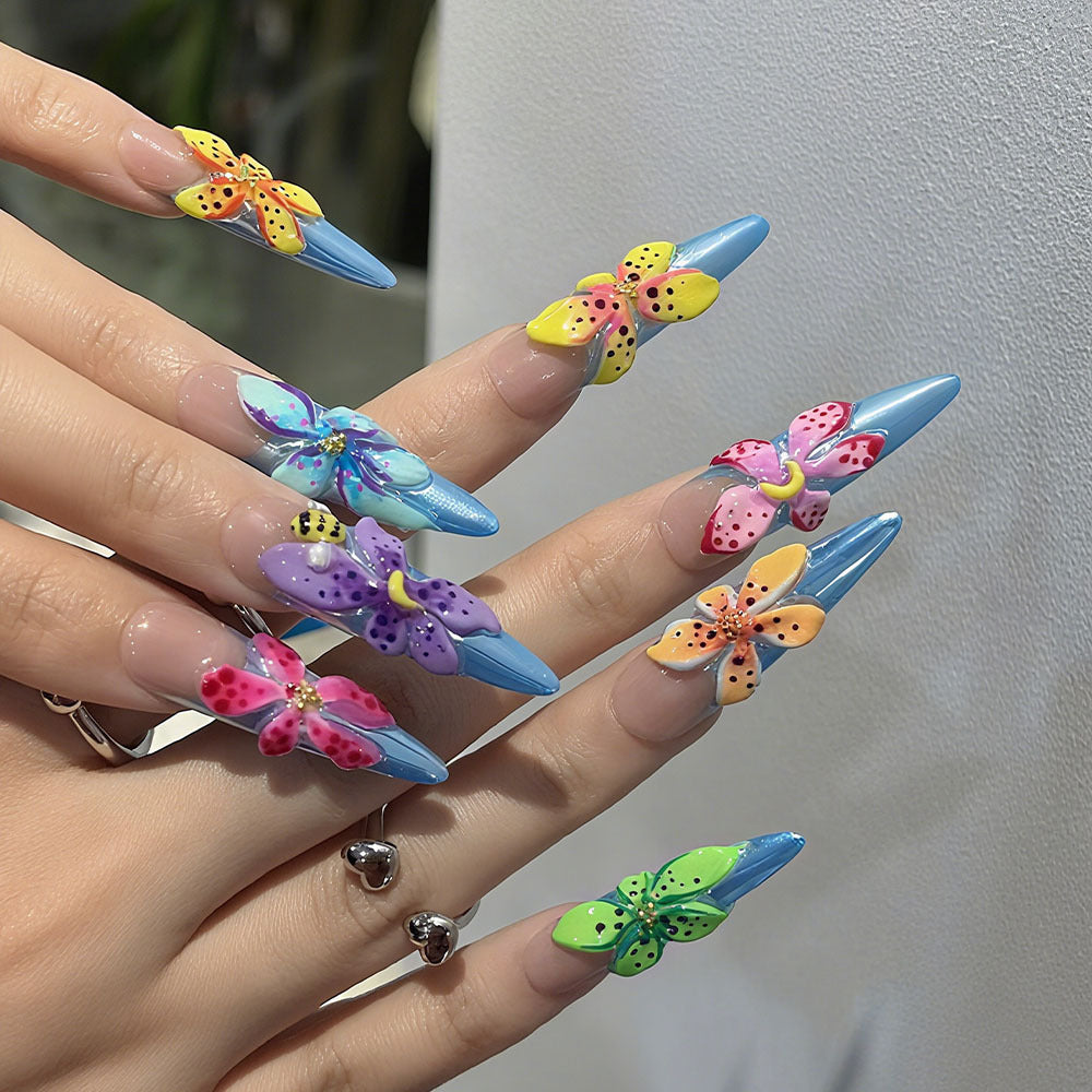 Artificial nails in a playful flower design with glittering accents Acalora