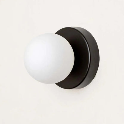 LumiGlobe – Modern wall light with glass block in Mid-Century style