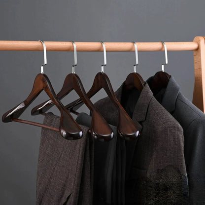 Luxurious wooden clothes hangers with a curved design