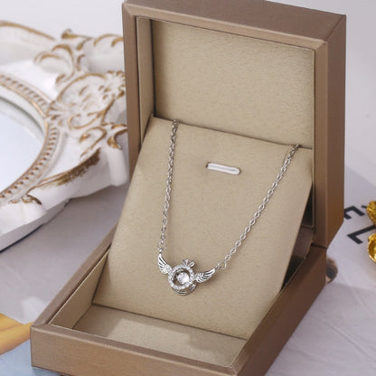 Skanto | Angel Wings Necklace – Titanium Steel Pendant with Rhinestones